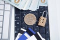 Bitcoin, money, credit cards and padlock on the white computer keyboard Royalty Free Stock Photo