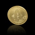 Golden bitcoin. Black background