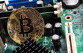 Bitcoin on motherboard Royalty Free Stock Photo