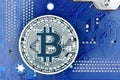 Bitcoin on motherboard Royalty Free Stock Photo