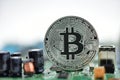 Bitcoin on motherboard Royalty Free Stock Photo