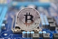 Bitcoin on motherboard Royalty Free Stock Photo