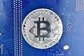 Bitcoin on motherboard Royalty Free Stock Photo