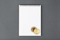 Bitcoin on a notebook, coin bitcoin on a table Royalty Free Stock Photo