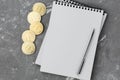 Bitcoin on a notebook, coin bitcoin on a table Royalty Free Stock Photo