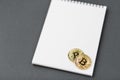 Bitcoin on a notebook, coin bitcoin on a table Royalty Free Stock Photo