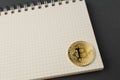 Bitcoin on a notebook, coin bitcoin on a table Royalty Free Stock Photo