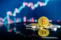 Bitcoin and other crypto coins with blurred candlestick chart