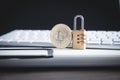 Bitcoin and padlock on the white computer keyboard Royalty Free Stock Photo