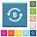 Bitcoin pay back white icons on edged square buttons Royalty Free Stock Photo