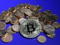 Bitcoin on a pile of Euro cents Royalty Free Stock Photo