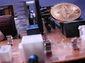 Bitcoin and power circuit board Royalty Free Stock Photo