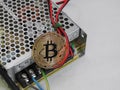 Bitcoin on power supply Royalty Free Stock Photo