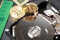 Bitcoin reflection on hard disk drive, cpu and ram stick in the background. Concept of crypto mining and digital currency