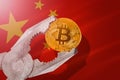 Bitcoin regulation in China; bitcoin btc coin being squeezed in vice on China flag background Royalty Free Stock Photo