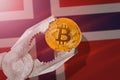 Bitcoin regulation in Norway; bitcoin btc coin being squeezed in vice on Norway flag background Royalty Free Stock Photo