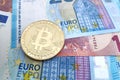 Bitcoin on a stack of Euro banknotes Royalty Free Stock Photo