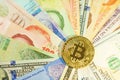 Bitcoin stack on multi national banknote bill background, bitcoin concept, dollar, baht, ringit, peso