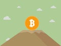 Bitcoin stands on top of the mountain and holds . Concept of Crypto currency.