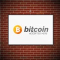 Bitcoin symbol on brick wall