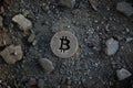 Bitcoin Symbol on Dirt or Debris