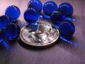 Bitcoin with ten blue glass marbles. Royalty Free Stock Photo