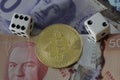 Bitcoin token with money and dice Royalty Free Stock Photo