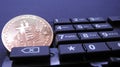 Bitcoin on top of computer number keyboard part Royalty Free Stock Photo