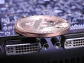Bitcoin on top of graphics processing unit or GPU Royalty Free Stock Photo