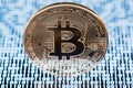 Bitcoin on white binary code background