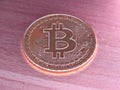 Bitcoin on wooden background. Royalty Free Stock Photo