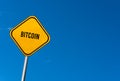 bitcoin - yellow sign with blue sky