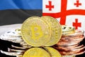 Bitcoins on Estonia and Georgia flag background