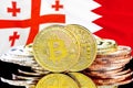 Bitcoins on Bahrain and Georgia flag background