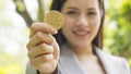 A bitcoins - Bitcoin in hand of a casual businesswoman to show the