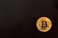 Bitcoins on a black background as an abstract symbol of the grow