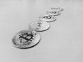 Bitcoins in black and white on the white background desk lined and organized presenting modern cryptocurrencies and blockchain Royalty Free Stock Photo