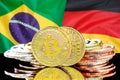 Bitcoins on Brazil and Germany flag background Royalty Free Stock Photo