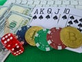 Bitcoins, cards and dices on keyboard closeup