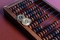 Bitcoins and classic abacus and symbol of new and old financial tool . Bitcoin is a crypto currency, a form of electronic cash. Royalty Free Stock Photo