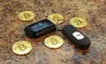 bitcoins cryptocurency with car key on granite table Royalty Free Stock Photo