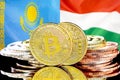 Bitcoins on Kazakhstan and Hungary flag background