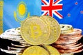 Bitcoins on Kazakhstan and New Zealand flag background