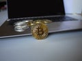 Bitcoins are on the keyboard of computer notebook.