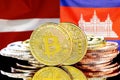 Bitcoins on Latvia and Cambodia flag background