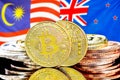 Bitcoins on Malaysia and New Zealand flag background