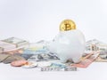 Bitcoins, New Virtual Money concept in piggy bank. Gold bitcoins