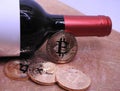 Bitcoins and wine. Royalty Free Stock Photo