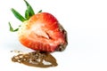 Bite of juicy strawberry covered in chocolate Royalty Free Stock Photo