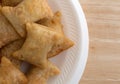 Bite size pepperoni pizza rolls on white foam plate Royalty Free Stock Photo